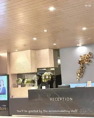 a reception room with flowers and acision at Vie Yśe - Pinterest-style Staycation Near MOA in Manila