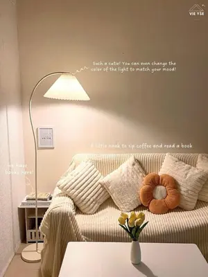 a living room with a couch with a table and a lamp at Vie Yśe - Pinterest-style Staycation Near MOA in Manila
