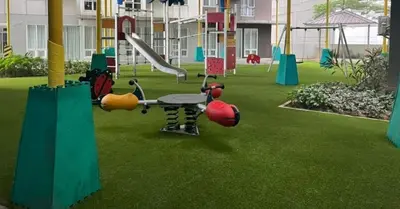a park with a playground with a swing set at The Nest - Woodlands in Manila