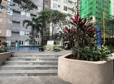 a group of stairs in a city with buildings at The Nest - Woodlands in Manila