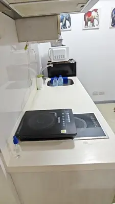 a kitchen counter with a phone on top of it at The Infinity Staycation in Manila