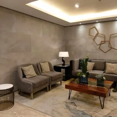 a living room with two couches and a coffee table at 1 Bedroom in S Residences in Manila