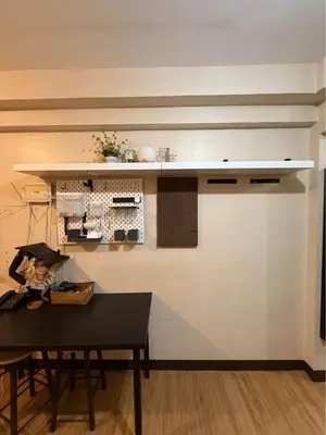 a kitchen with a counter and a table and a table sidx sidx at Studio Near NAIA Airport in Manila