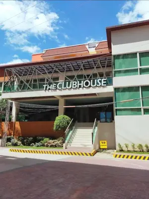 a building with a sign that reads the clubhouse at Studio Near NAIA Airport in Manila