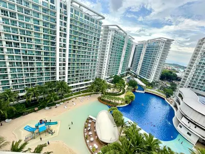 a view of a resort with a beach and buildings at Miami tower azure staycation in Manila