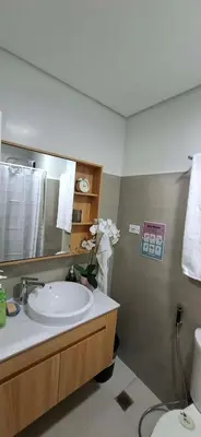 a bathroom with a sink and a mirror at Shortstay at Shore 2 in Manila