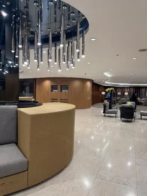 a lobby with a chandelier in a hotel at Shortstay at Shore 2 in Manila