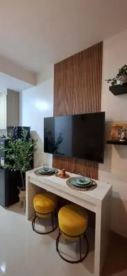 a white table with two chairs and a table with two plates at Shortstay at Shore 2 in Manila