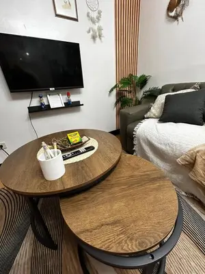a living room with two tables and a couch at Chic Haven Home away from home in Imus
