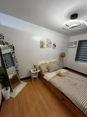 a bedroom with a large bed in a room at Chic Haven Home away from home in Imus