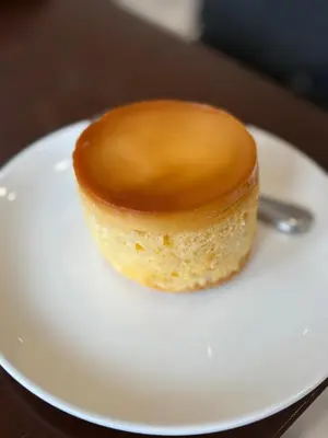 a small dessert on a white plate on a table at S Residences pool side 3 in Manila