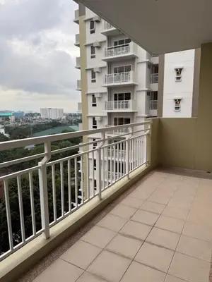 a balcony with a view of a building at Stylish Cozy Nordic 2BR Netflix & Free Parking in Manila