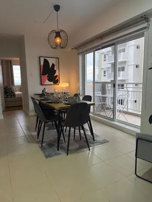 a dining room with a table and chairs and windows at Spacious 3BR Sucat Netflix and Free Parking in Manila