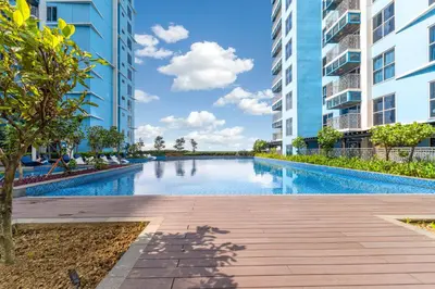 an infinity pool in a building with tall buildings at High-Floor Stay near Okada, Airport, City of Dreams, Solaire and MOA with free pool and gym access in Manila