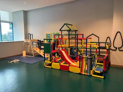 a childrens play room with a colorful playground at Aesthetic Modern Suite 1BR One Uptown Residence BGC in Manila