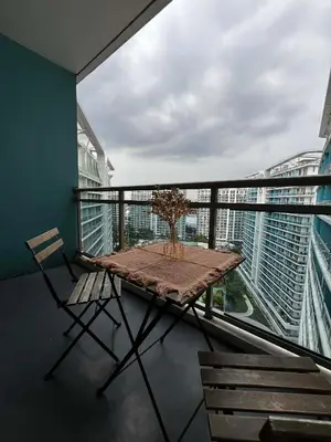 a balcony with a table and chairs on a balcony at Zyron Suite in Manila
