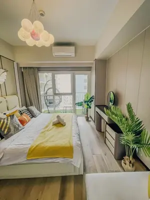 a bedroom with a large bed and a large window at Spacious & Luxury 4BR Home across Okada and Solaire in Manila
