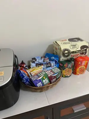 a basket of chips and other snacks on a counter at Cozy BB in the Heart of Quezon City in Manila