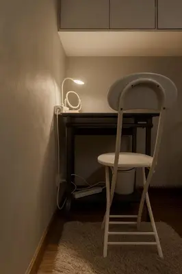 a chair sitting at a desk with a lamp at Islana Stay for Family of 3 in Gen Trias Cavite in General Trias