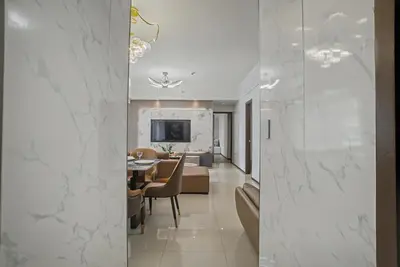 a living room and dining room with a dining table at Modern and Spacious 3BR Home near Solaire & Okada in Manila