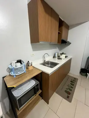 a small kitchen with a sink and a counter at Antel Spa Residences 1703 in Manila