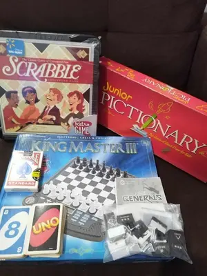 a table with two video games and a keyboard at Metro Home Staycation in Manila