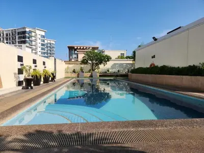 a swimming pool in the middle of a building at Stamford Executive Residences, McKinley Hill in Manila