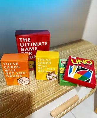 a group of books sitting on top of a table at Cozy Modern Condo in Little Baguio Terraces San Juan City in Manila