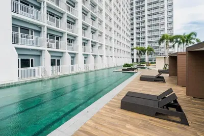 a swimming pool in the middle of a building at CG Staycation Hub in Manila