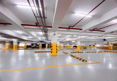 an empty parking garage with yellow and white floors at 120 Sqm Modern 3Bedrooms HighRise Facing Manila Bay, Near Airports, Okada Casino, Solaire Casino, MOA with free parking in Manila