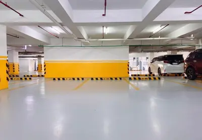 a parking garage with two cars parked in it at 120 Sqm 3Bedrooms Facing Manila Bay Sunset, Airports, Okada, Solaire, MOA, free parking in Manila