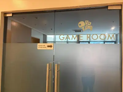 a glass door with a game room sign on it at Japandi Haven with Uptown Mall Fountain View One Uptown BGC in Manila