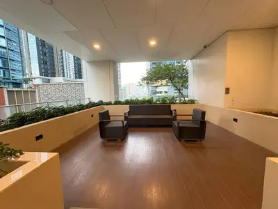 a meeting room with chairs in an office building at Japandi Haven with Uptown Mall Fountain View One Uptown BGC in Manila