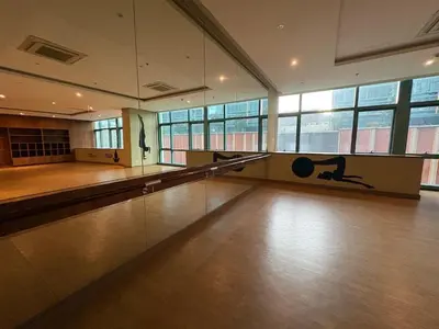 a bowling alley with a person on the floor at Japandi Haven with Uptown Mall Fountain View One Uptown BGC in Manila