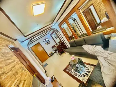 an overhead view of a living room in a tiny house at City Condo Perfect for Family & Friends in Manila