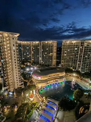 a view of a city at night with tall buildings at Staycation Condotels RD in Manila