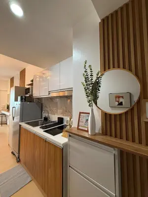 a kitchen with a large mirror on the wall at Stunning 41F Skyline View Relaxing City Escape in Manila