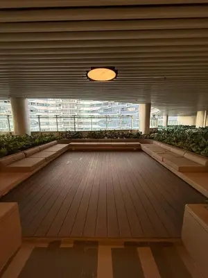 a large room with a wooden floor and a large window at Stunning 41F Skyline View Relaxing City Escape in Manila