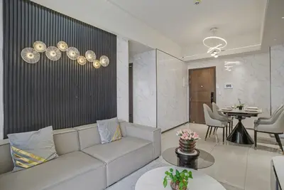 a living room with a couch and a table at Luxury Home near Solaire and Okada Manila in Manila