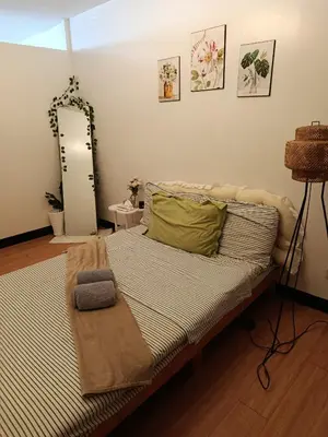 a bedroom with a bed with a mirror on the wall at Chic Haven Home away from home in Imus
