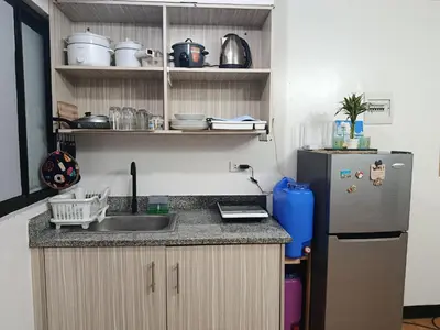 a kitchen with a sink and a refrigerator at Chic Haven Home away from home in Imus
