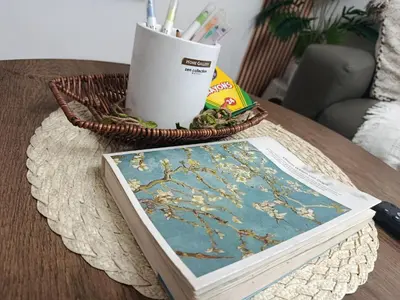 a book on a table with a basket of pens at Chic Haven Home away from home in Imus