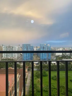 a view of a city from a balcony at 3Ms Homestay Shore in Manila