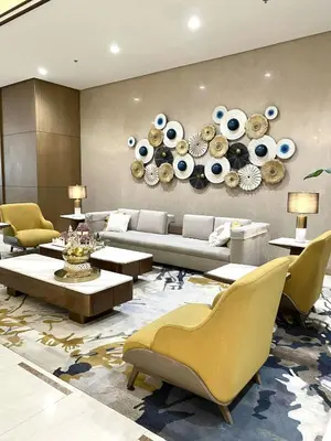 a living room with a couch and tables and chairs at Park Mckinley West Luxury 1Br Suite in Manila