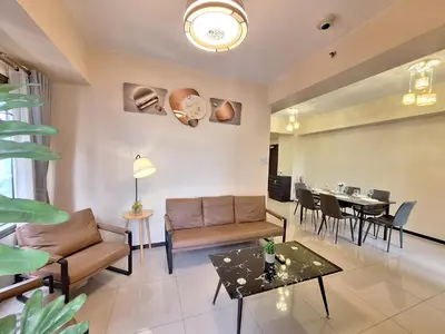 a living room with a couch and a table at GOUTEI Homestay - The Radiance Manila Bay in Manila