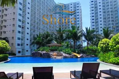 a large swimming pool in front of a hotel at Shore ka na ba in Manila