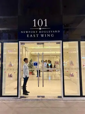 a man standing in front of a store window at J&A CondoStay Near NAIA Terminal 3 in Manila