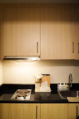 a kitchen with a sink and a counter top at SMDC LIGHT Balcony Smart TV Alexa Cozy Retreat in Manila