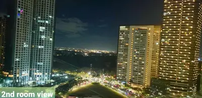 a view of a city at night with tall buildings at BGC Forbes Area Your Home Away From Home in the Heart of BGC with hi-speed Wi-Fi PrimeVideo,Disney ,Netflix in Manila