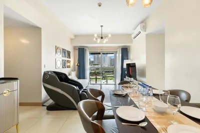a dining room with a table and chairs at Seaview 2BR CondoteI Near Airport,NAIA, MOA ,Okada Casino in Manila